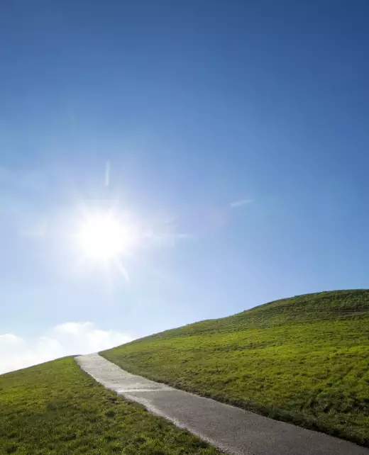 55314-sun-shining-over-paved-road-on-grassy-hillsi-2025-04-04-12-42-06-utc 55314-sun-shining-over-paved-road-on-grassy-hillsi-2025-04-04-12-42-06-utc